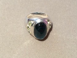 An Indicolite Ring Accented by Demantoid Garnets